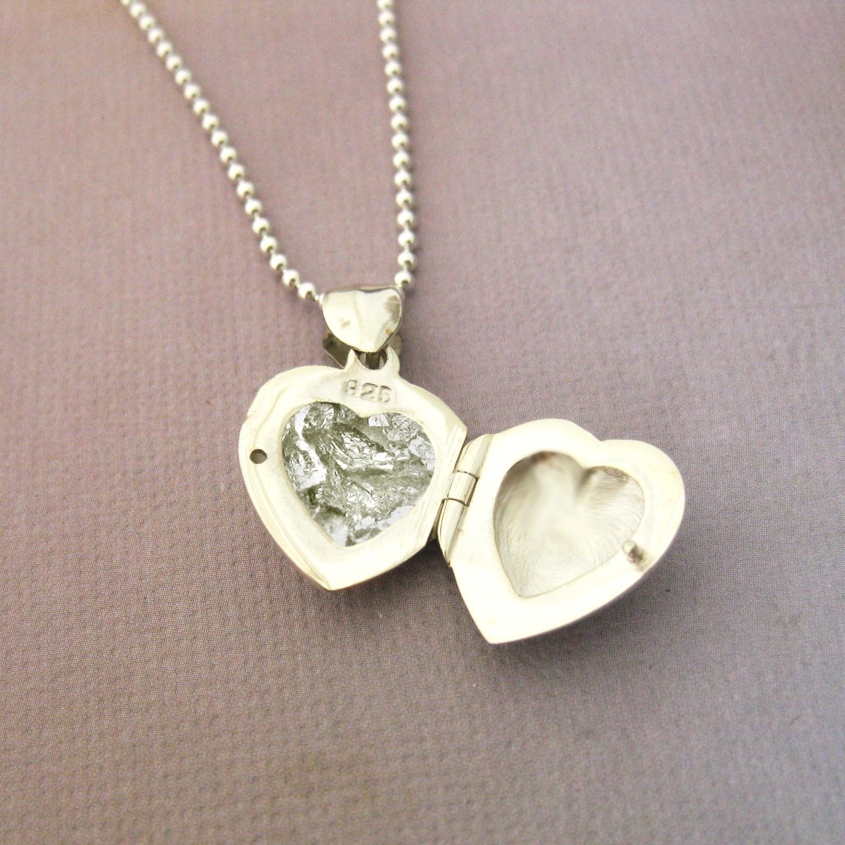 Add Ashes, A Lock of Hair, Fur, or anything you would like permanently sealed in a locket. - Luxe Design Jewellery