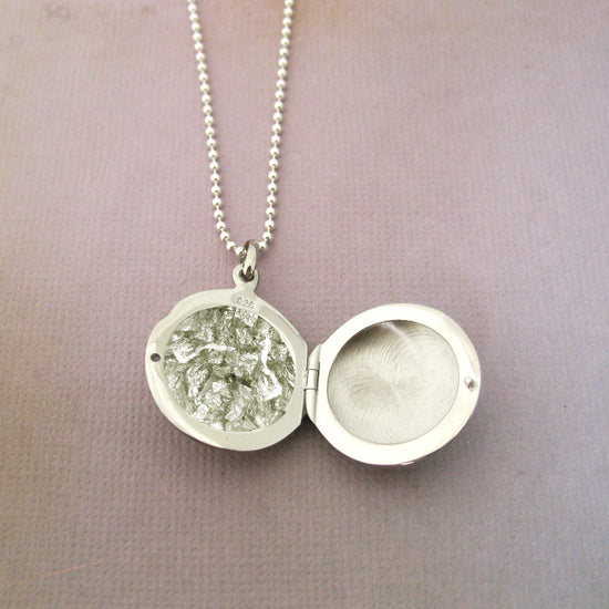 Add Ashes, A Lock of Hair, Fur, or anything you would like permanently sealed in a locket.